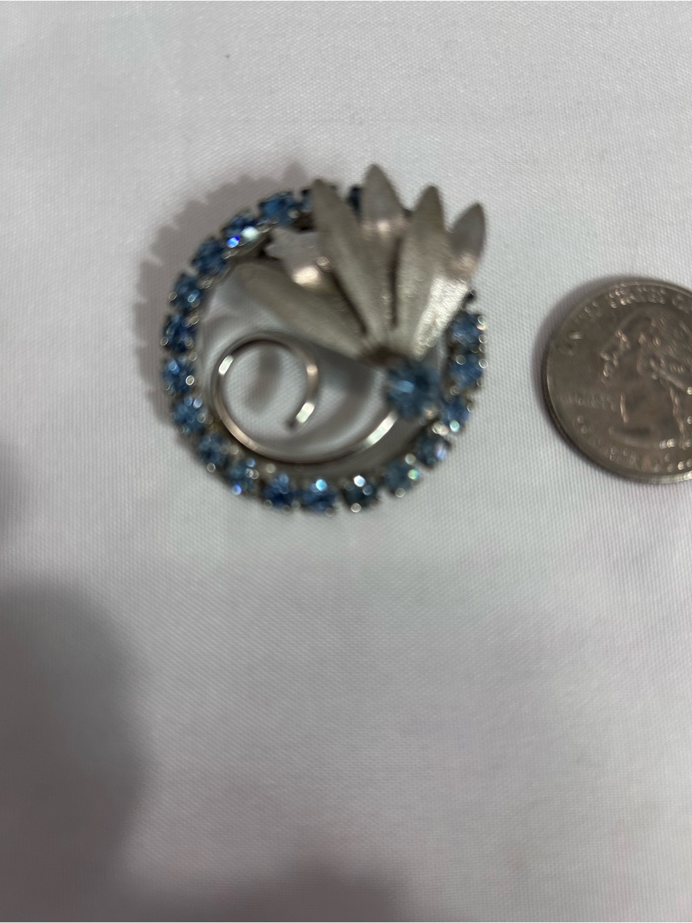 Silver-Tone Brooch with Blue prong set rhinestone and silver tone fan